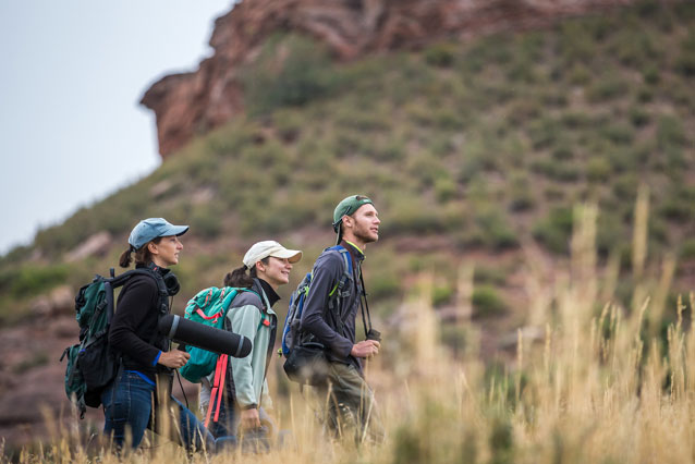 UNC Extended Campus students walking mountainside for field experience