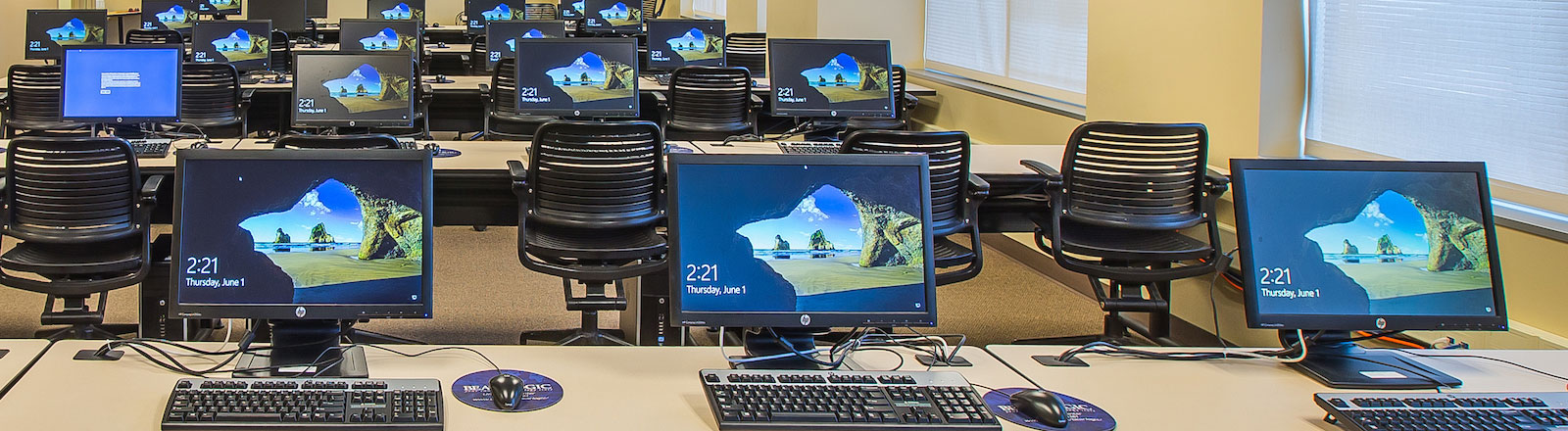 Photo of multiple workstations in a computer lab