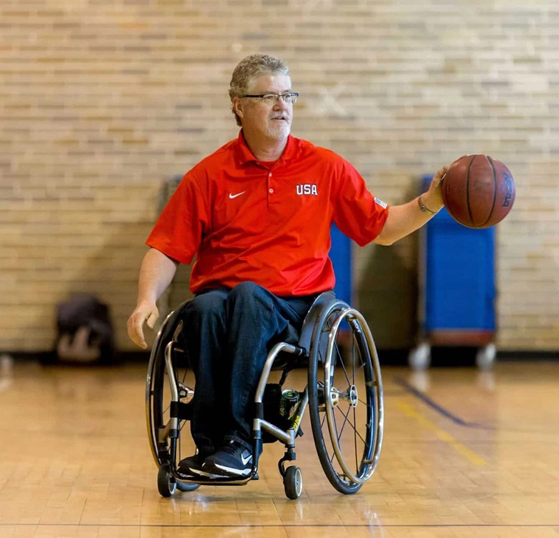 Sport Coaching Master's Degree Program Coordinator Scott Douglas playing indoor basketball.