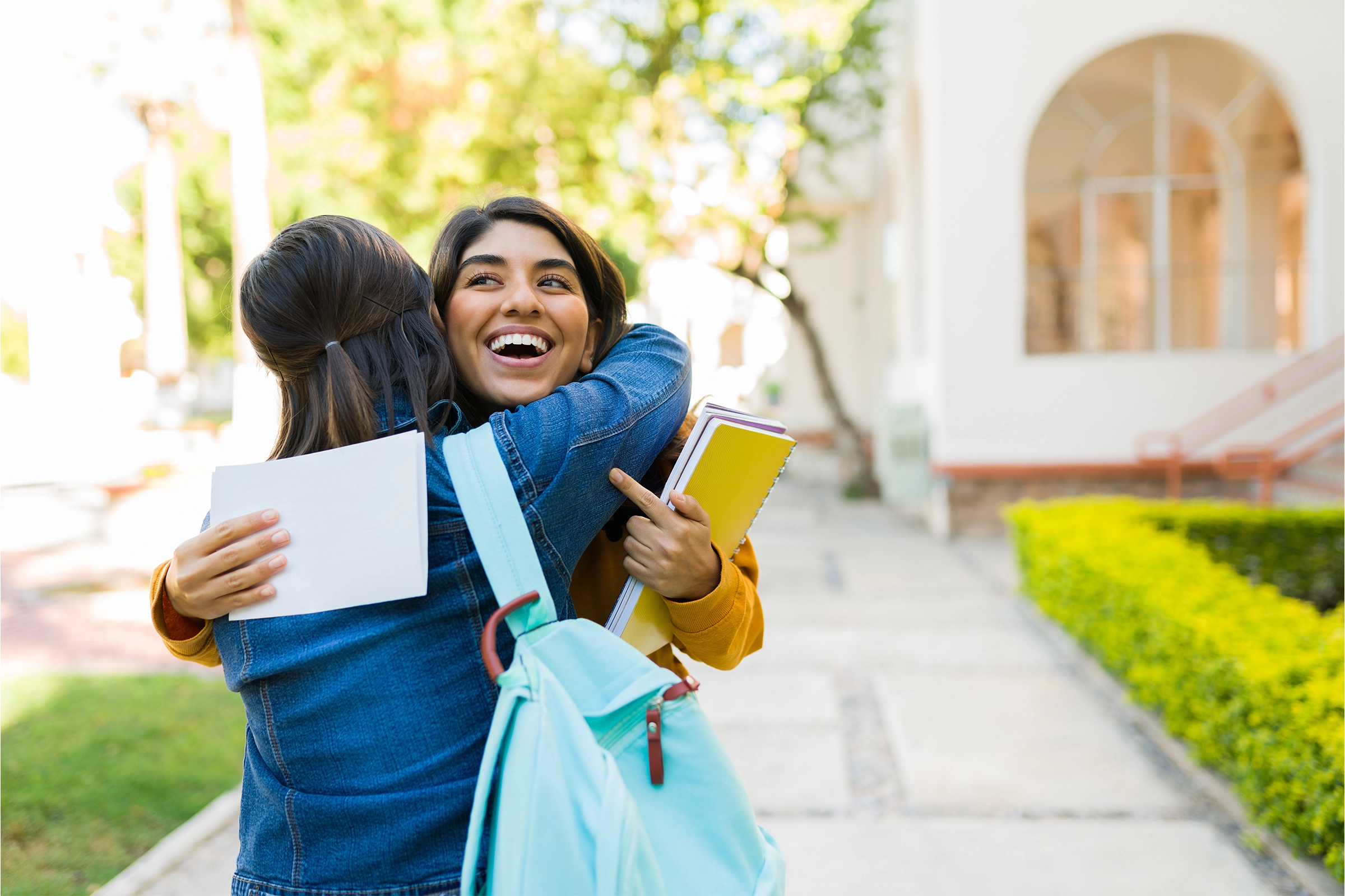 New student hugging her friend.