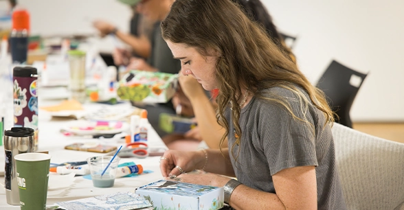 Art students painting in class.