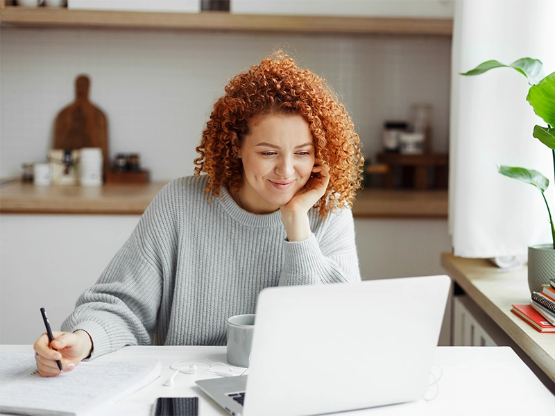 Early Childhood education bachelor's degree completion student doing coursework online on her laptop.