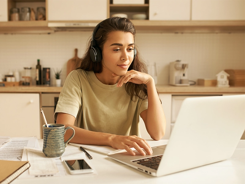Sociology bachelor's degree completion student doing coursework online on her laptop.