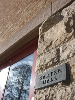 Close up of entrance sign for Carter Hall on UNC campus