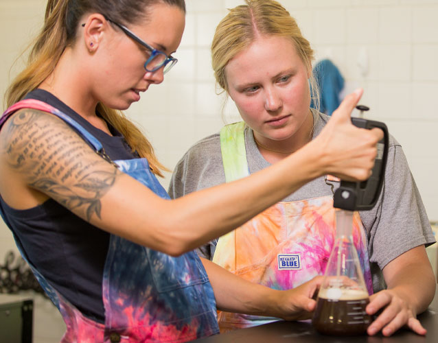 Photo of brewing certificate students testing a sample