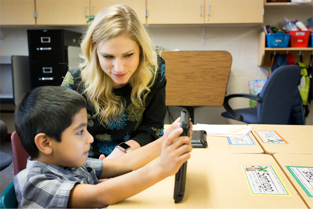 Photo of teacher teaching student