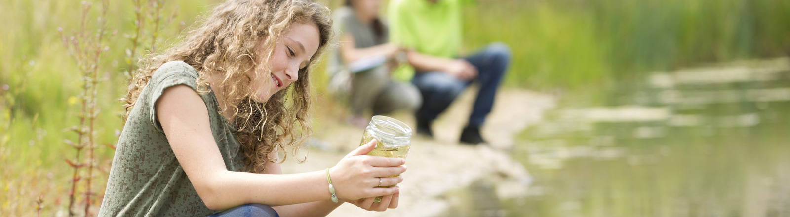 Photo of Child Collecting Samples Outdoors