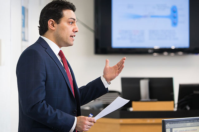 Superintendent presenting to a group of educators