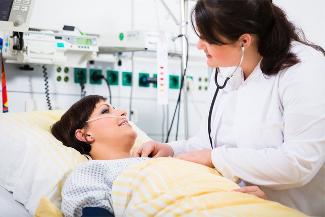 Three nursing students learn from their teacher