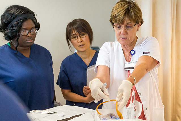 Nurses observing the prep/assembly of medical tubing